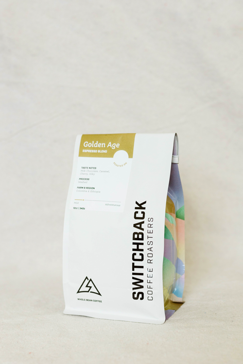 A white bag of coffee beans from Rosso Coffee Roasters